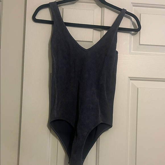 Aura Tops - Aura ribbed V-neck bodysuit in a blue-gray color.